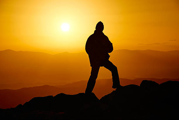 istock Man on the mountain in the evening 531948113