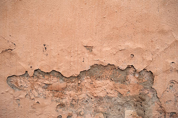 istock Texture of old wall covered with pink stucco 531949881