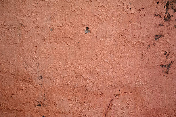 istock Texture of old wall covered with pink stucco 531949897