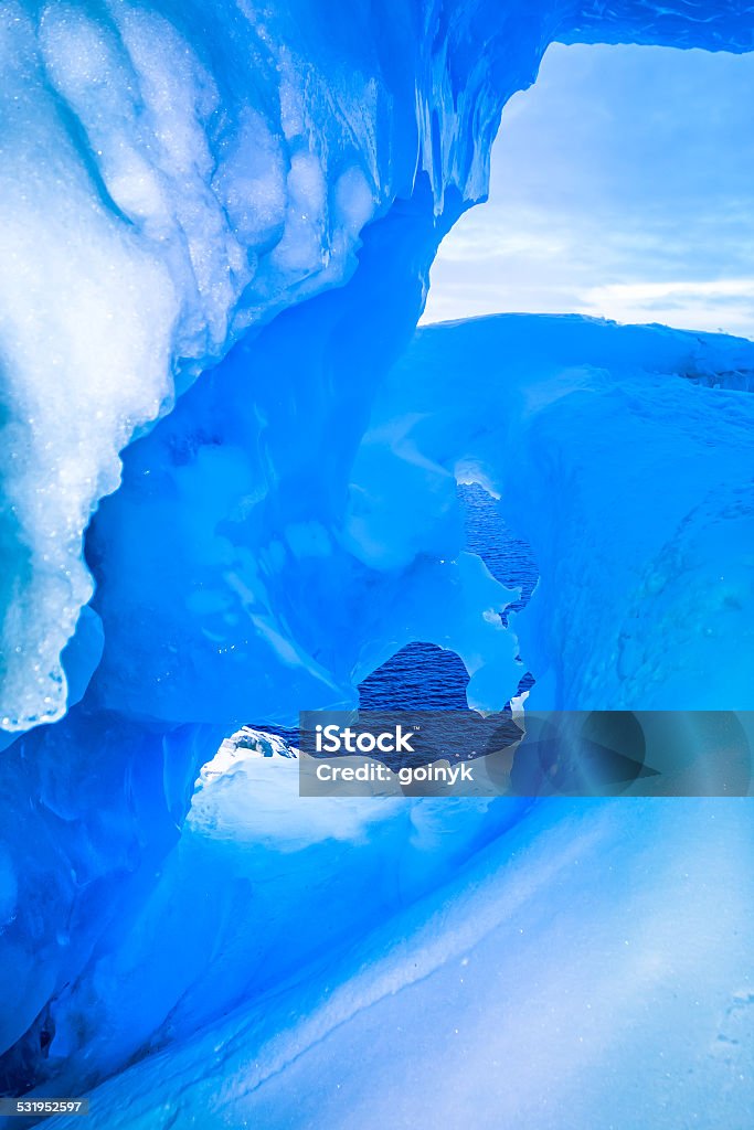 blue ice cave blue ice cave covered with snow and flooded with light 2015 Stock Photo