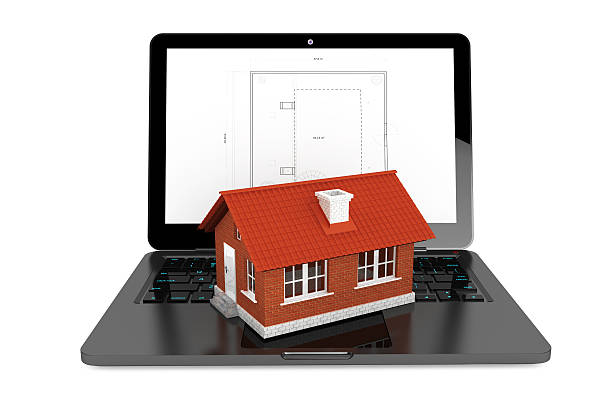 istock 3d House over Laptop with House Project Blueprint 531954345