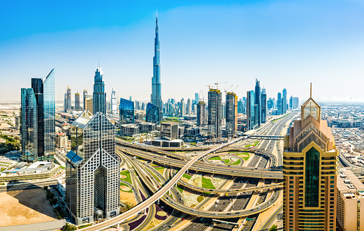 High resolution image of modern skyscrapers with world's tallest building Burj Khalifa (2016/5) in Downtown Dubai, United Arab Emirates. Dubai is fastest growing city of the world. Large number of tall skyscrapers are built along E11 Sheikh Zayed Road highway with metro line and around futuristic traffic junction. Taken by Sony a7R II, stitched from several photos.