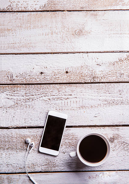 istock Smartphone, earphones and coffee cup. Flat lay. Copy space. 531969792