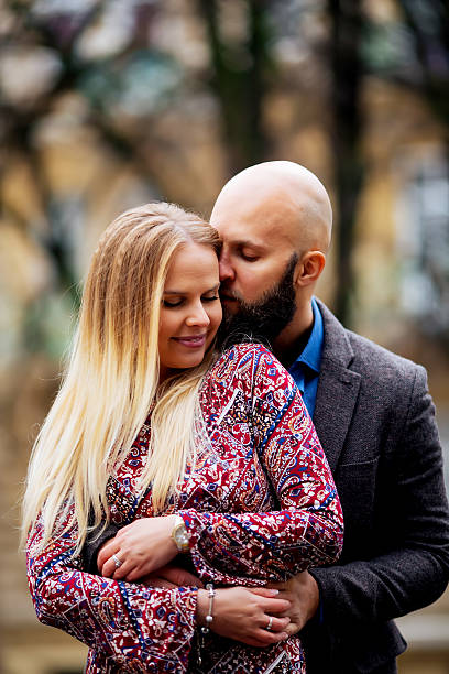 istock Young couple in love, hugging on the street. Selective focus. 531969836