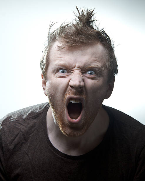 istock Man in a dark brown t-shirt with flare looking up 531970342