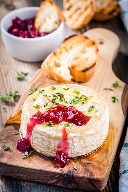 istock Baked camembert with cranberry sauce and thyme 531970542