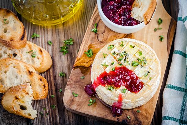 istock Baked camembert with cranberry sauce and thyme 531970656