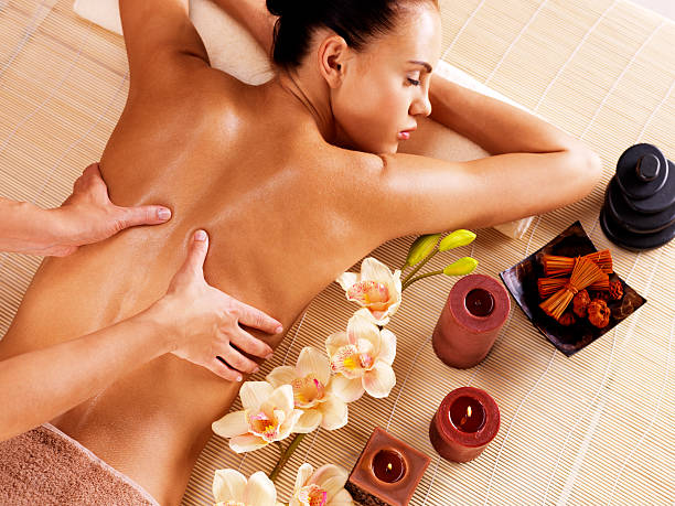 istock Masseur doing massage on woman back in spa salon 531970866