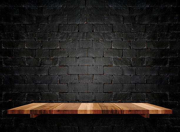 istock Empty wooden shelfs on pastel grunge black brick wall, 531971480