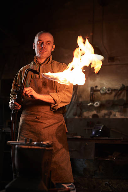 istock Blacksmith heats the gas burner 531972808