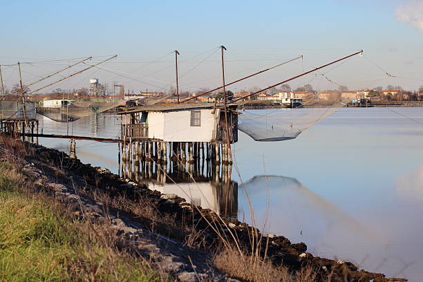 fishermen huts in lagoons - comacchio bildbanksfoton och bilder