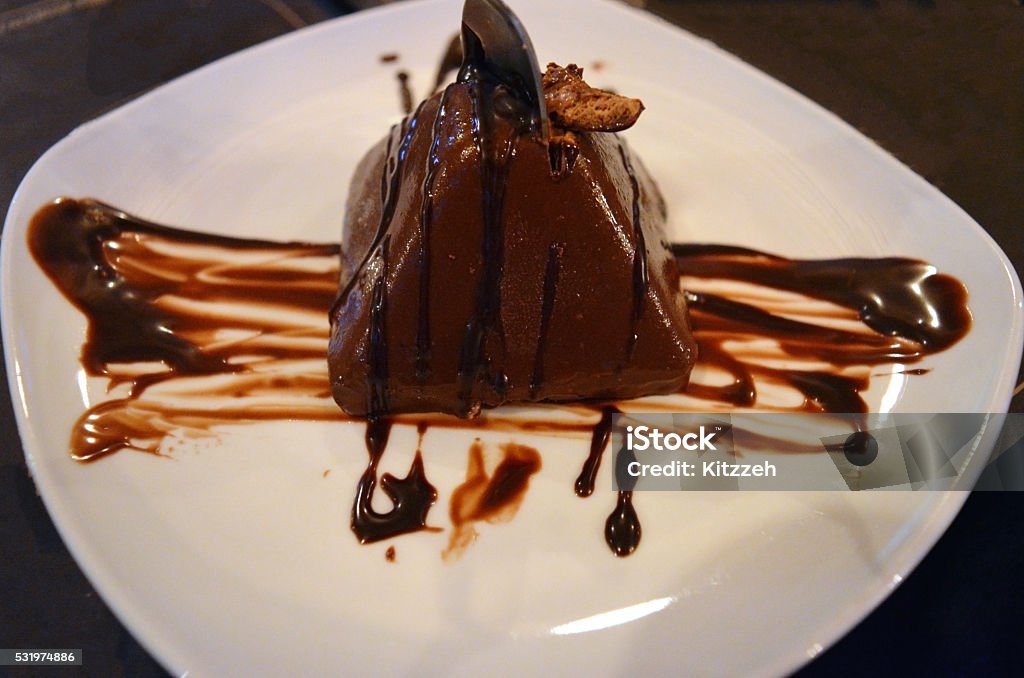 Chocolate mousse pyramid Chocolate mouse pyramid from the restaurant. Baked Stock Photo