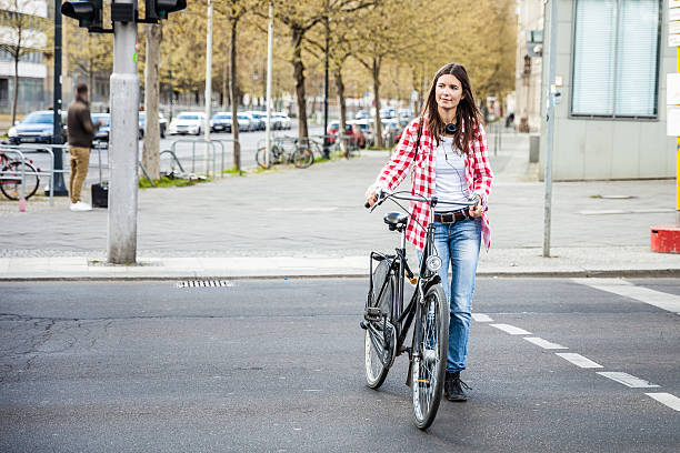 istock Woman walking with bicycle in Berlin 531975128