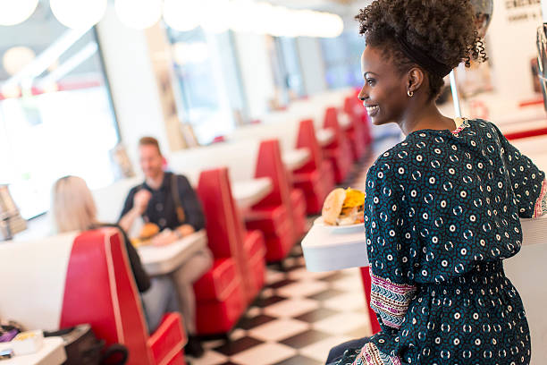 Young african american woman in the diner
