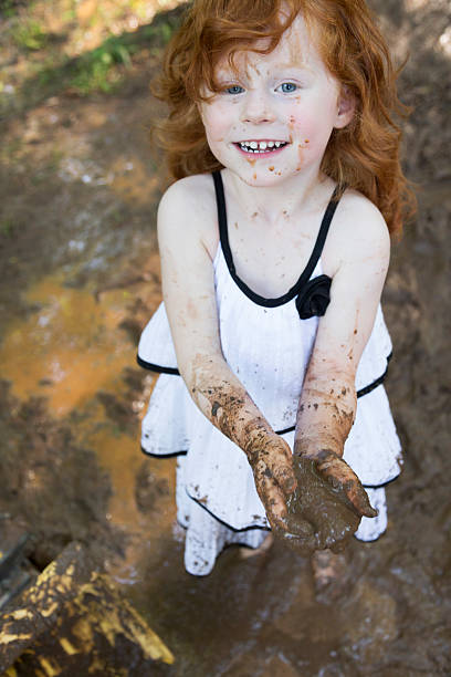 istock Little Girls Play in the Mud 531977498