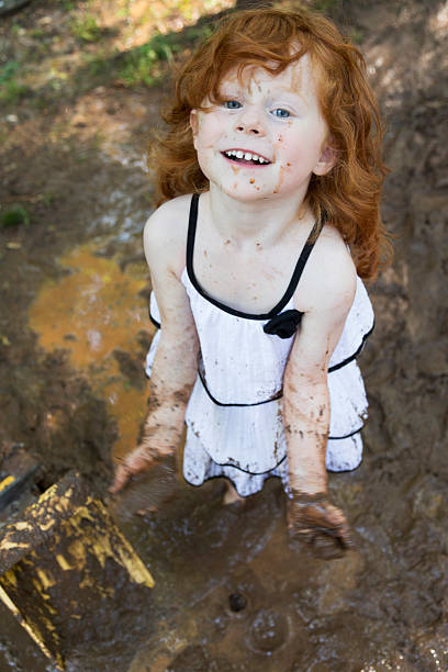 istock Little Girls Play in the Mud 531977542