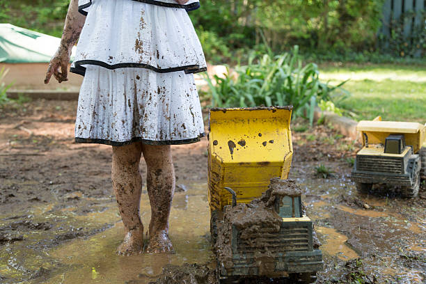 istock Little Girls Play in the Mud 531977648