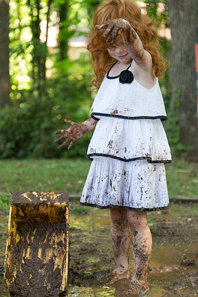 istock Little Girls Play in the Mud 531979008