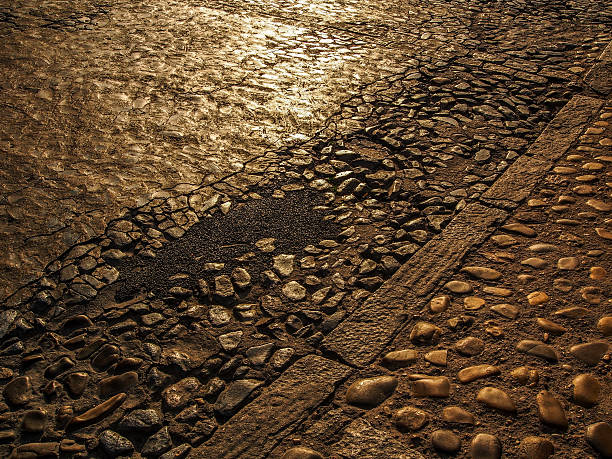 istock Sunset reflections on the rocky road in Toledo, Spain 531979244