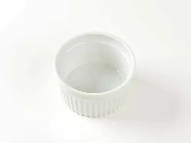 Empty small white porcelain ramekin