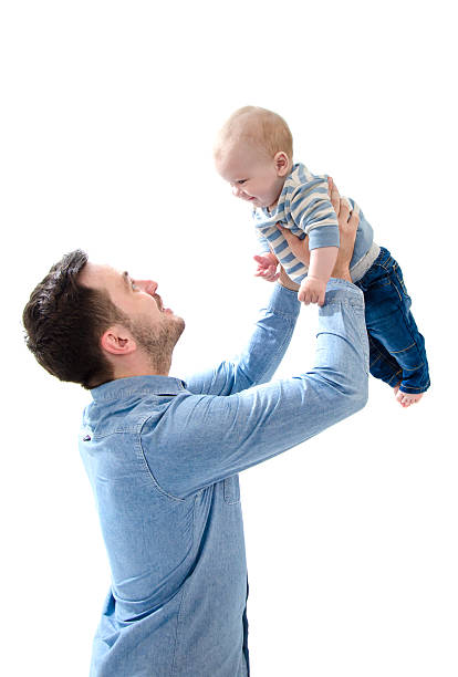 istock Father raise his new born baby on hands isolated 531981390