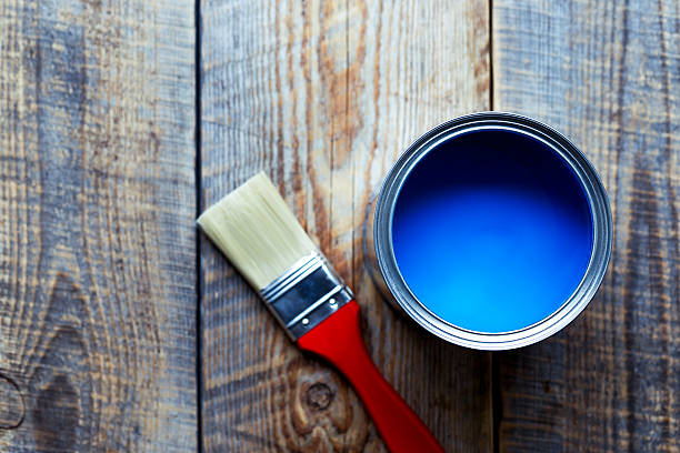 istock jar with blue paint on the wooden background top view 531982740