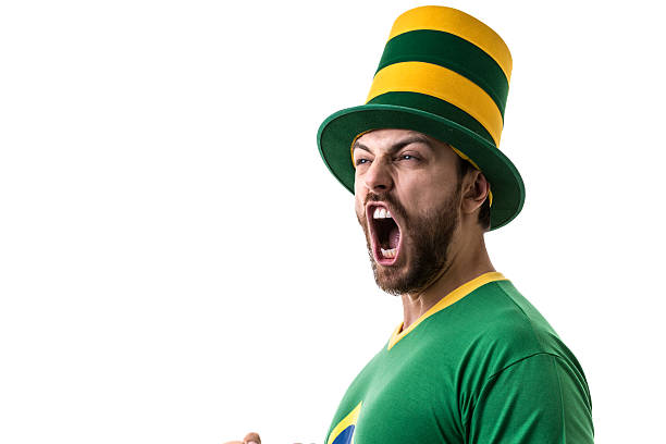 istock Brazilian young fan celebrating on white background 531982818