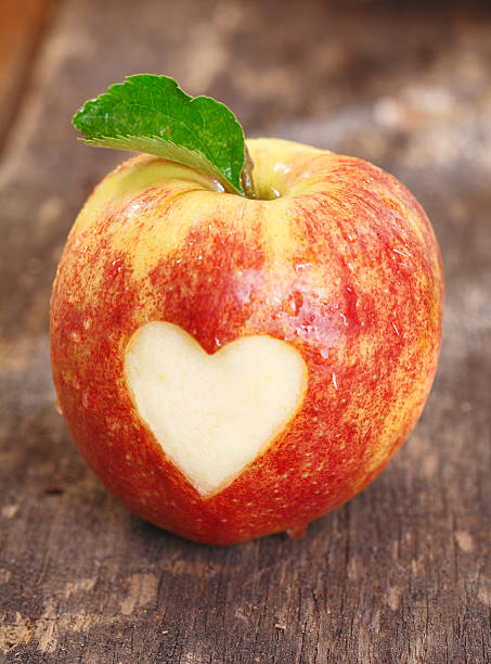 istock Ripe red apple with heart shape 531983723