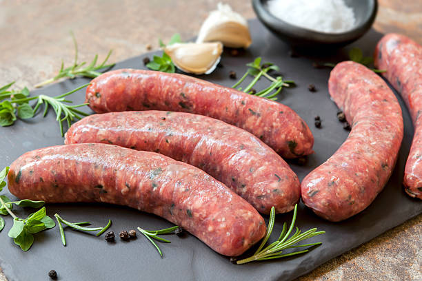 istock Raw Sausages on Slate with Herbs and  Spices 531984820
