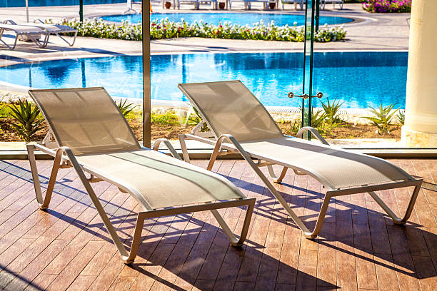 istock Sunbeds in the indoor swimming pool 531985523