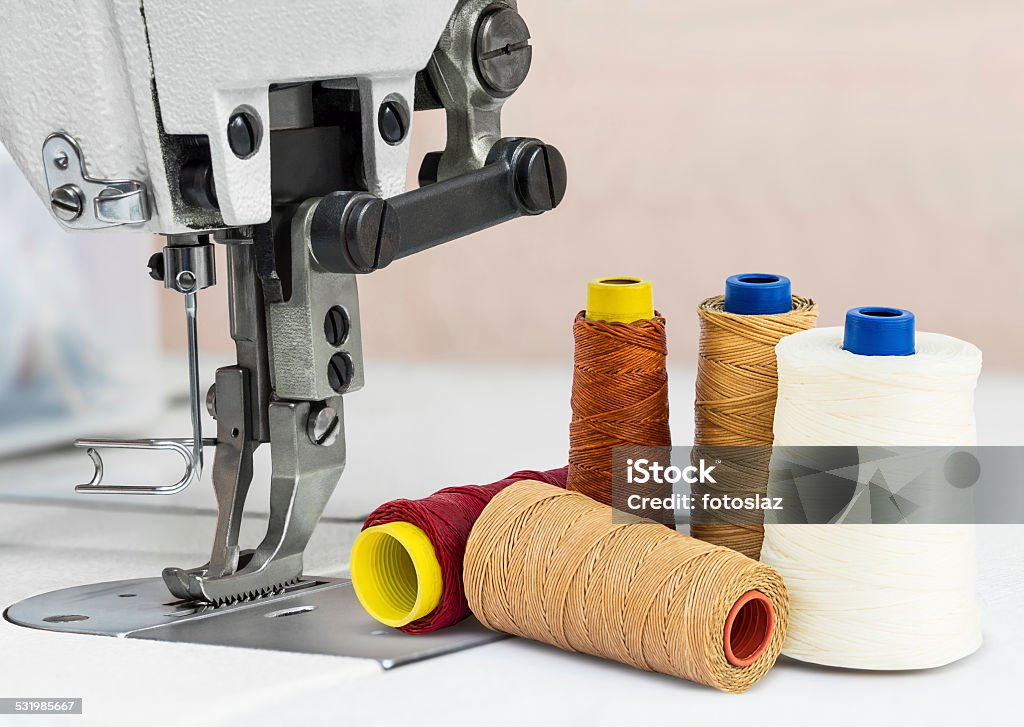 Sewing machine Sewing machine and bobbins of thread for textile industry 2015 Stock Photo