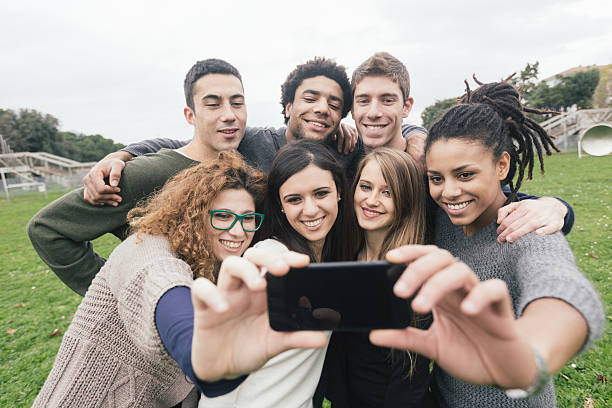 istock Multiethnic Group of Friends Taking Selfie at Park 531985913