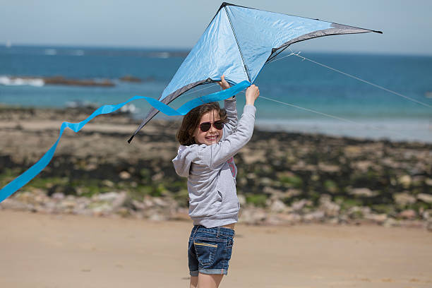 istock Young girl playing at the beach 531985992