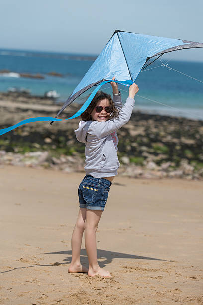 istock Young girl playing at the beach 531986056