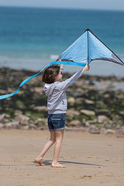 istock Young girl playing at the beach 531986178