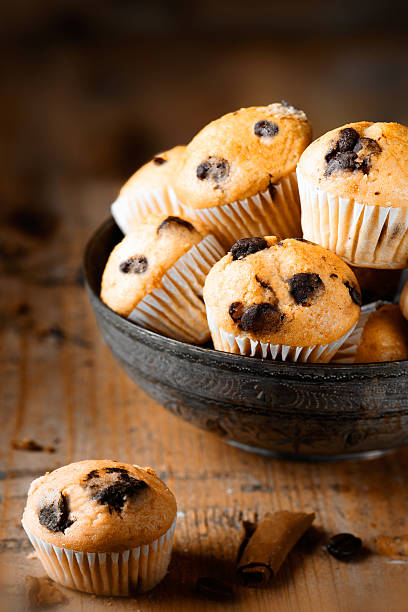istock Fresh mini muffins on aged wood background 531986233