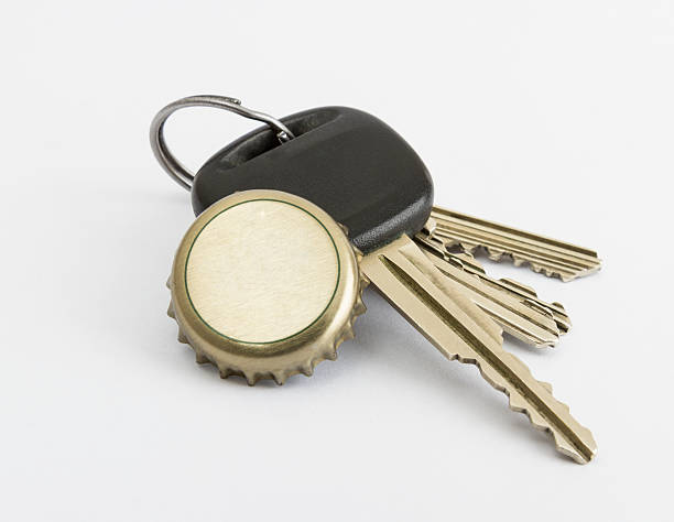 istock car key and bottle cap in close up 531986327