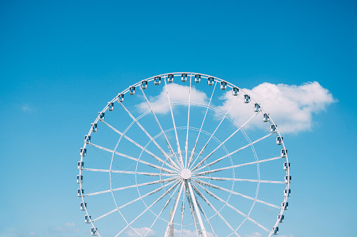 Ferris wheel on a blue sky background (Paris, France)