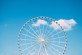 Ferris wheel on blue sky background (Paris, France)