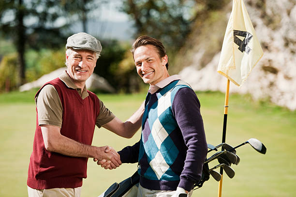 istock Italy, Kastelruth, Golfers on golf course smiling shaking hands 531988159