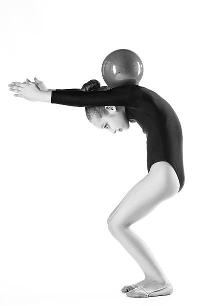 istock Girl doing gymnastic exercises or exercising on white background 531988210