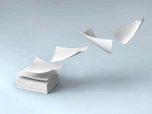 white papers - flying paper stock-fotos und bilder