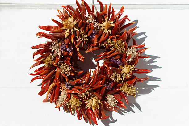 istock Santa Fe Style: Red Chili Pepper Wreath On White Door 531989439