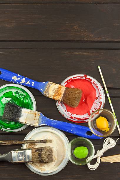 istock Brushes and paint on a wooden table 531989966