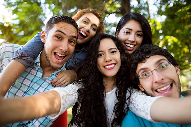 istock Group of Hispanic friends taking a self-portrait 531990776