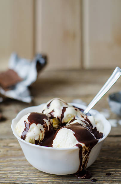 istock vanilla ice cream in white bowl with chocolate 531990811
