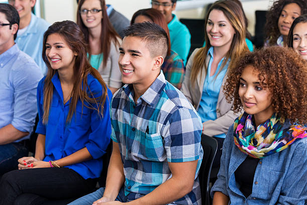 istock Teens and adults listening to speaker during lecture or orientation 531990953