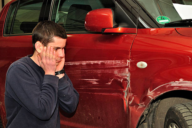 istock Car driver with his damaged car. 531991115