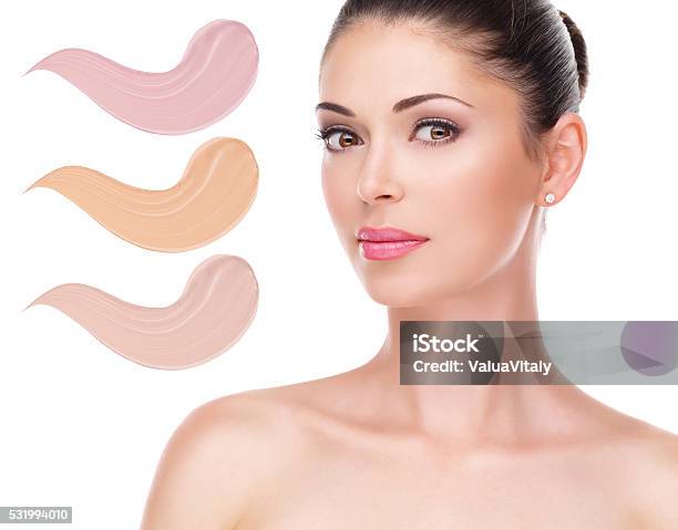 Model Face Of Beautiful Woman With Foundation On Skin Stock Photo - Download Image Now