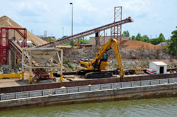 backhoe digs inflow to protect fish population in lake